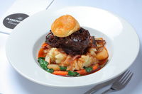 Beef Cheeks slow cooked in red wine, cream, mushroom and onion served on creamy mash & vegetables.   	